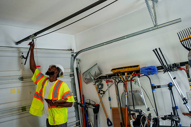 Professional Garage Door Panel Replacement technician working in Malad City, ID